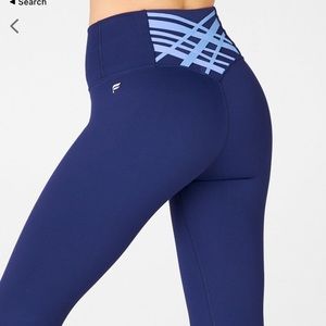 blue fabletics leggings with cute crosses in the back!